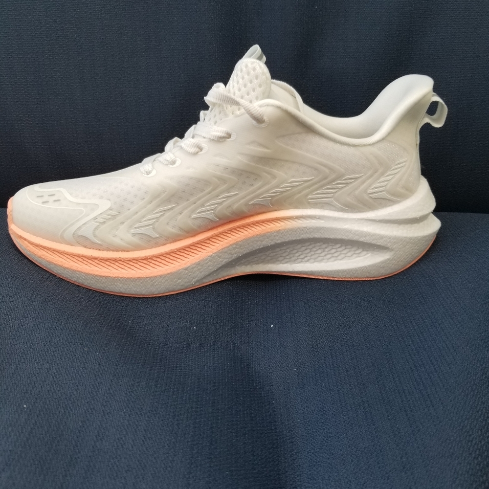 Cream and Orange Athletic Shoes with Modern Design